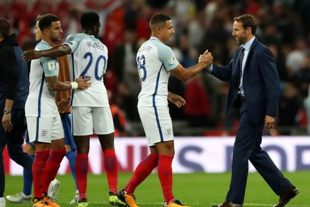 England manager Gareth Southgate shakes hands with Jake Livermore and his England team-mates after beating Slovakia 2-1. Picture: Nick Potts/PA
