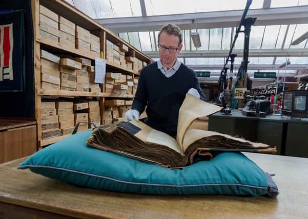 John Gaunt, Joint MD of Edwin Woodhouse Co Ltd, looking through one of the many guards books.

Picture James Hardisty.