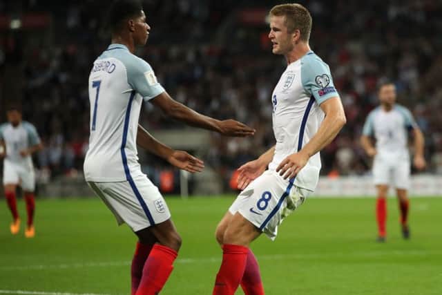 England's Eric Dier celebrates scoring his side's first goal of the game with Marcus Rashford, left, at Wembley on Monday night. Picture: Nick Potts/PA