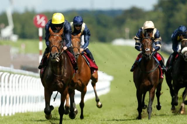 Crystal Ocean (left) ridden by Ryan Moore wins The Qatar Gordon Stakes at the Goodwood Festival. Picture: Paul Harding/PA Wire