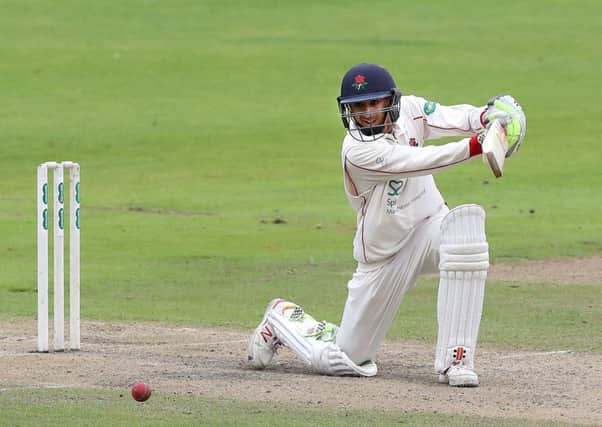 Lancashire's Haseeb Hameed hits through the covers off Essex's Paul Walters at Old Trafford on Wednesday. Picture: Martin Rickett/PA