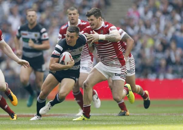 Hull FC's Jamie Shaul and Wigan Warriors' John Bateman battle during the Challenge Cup Final at Wembley. The two sides meet again tonight at the KCOM Stadium. Picture: Paul Harding/PA.
