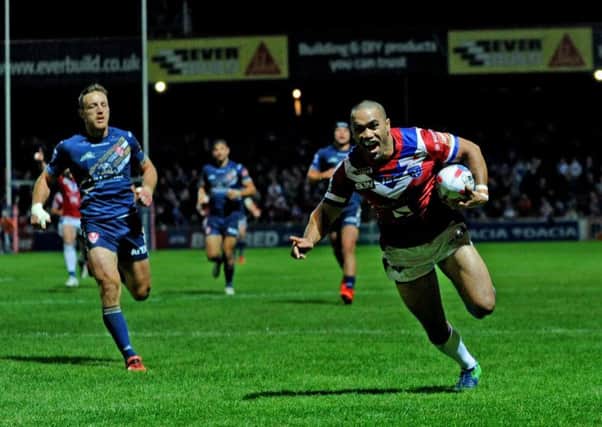 Wakefield's Bill Toupou goes over to score his second try. Picture Jonathan Gawthorpe