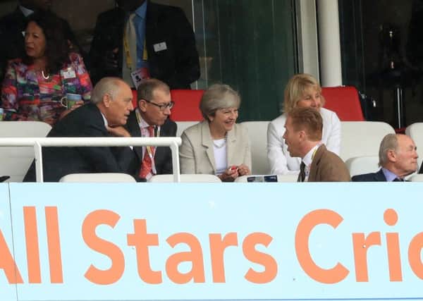 Theresa May watches England at Lords today