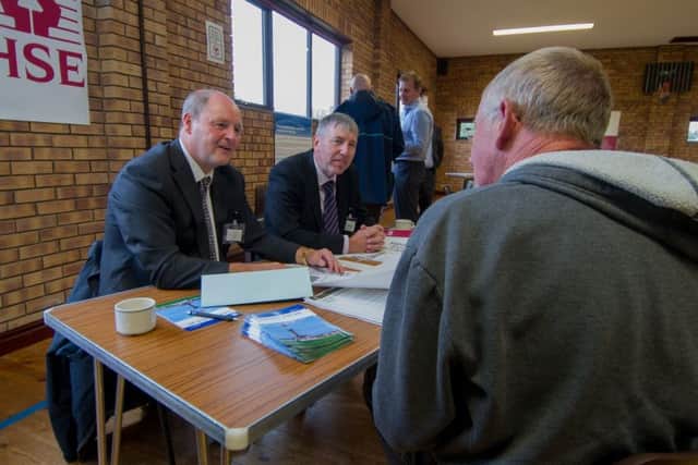 Date: 7th September 2017.
Picture James Hardisty.
A meeting organised by the regulators for Ryedale residents and anti-fracking campaigners held at Kirby Misperton Village Hall in Kirby Misperton, near Malton. to explain how the local environment will be protected during fracking  process.
Pictured A local resident chatting with Kieith and Tony, from the Health & Saftey Executive.
NOTE: No surname given for agency staff.