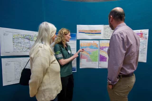 Date: 7th September 2017.
Picture James Hardisty.
A meeting organised by the regulators for Ryedale residents and anti-fracking campaigners held at Kirby Misperton Village Hall in Kirby Misperton, near Malton. to explain how the local environment will be protected during fracking  process.
Pictured Ruth and Tim, from the Environment Agency chatting with a local resident.
NOTE: No surname given for agency staff.