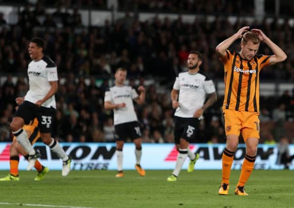 Hull City's Seb Larsson reacts after missing his penalty.