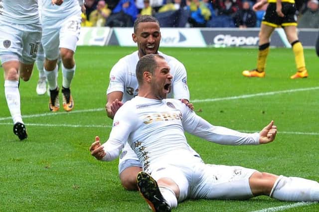 Dream debut: Pierre-Michel Lasogga, front, celebrates his goal which capped a starring role for the Hamburg loanee on his Leeds United bow. (Pictures: Jonathan Gawthorpe)