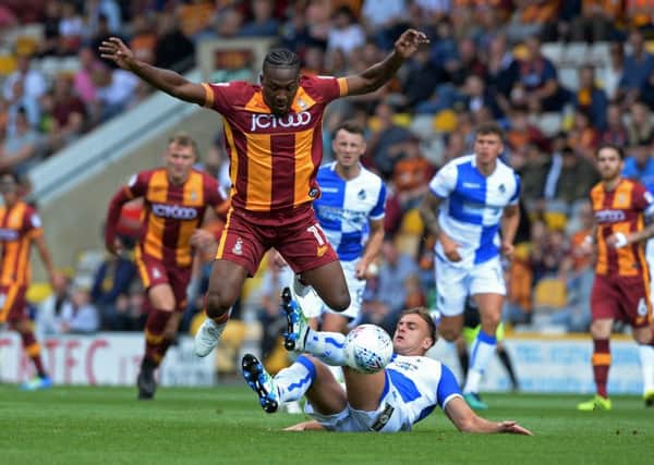 Dominic Poleon, pictured leaping to avoid Jonathan Burn's challenge, was on the scoresheet against Peterborough. (Picture: Bruce Rollinson)