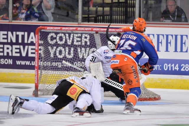 YOU BEAUTY: Levi Nelso scores the late, late, winning goal for Sheffield Steelers. Picture: Dean Woolley