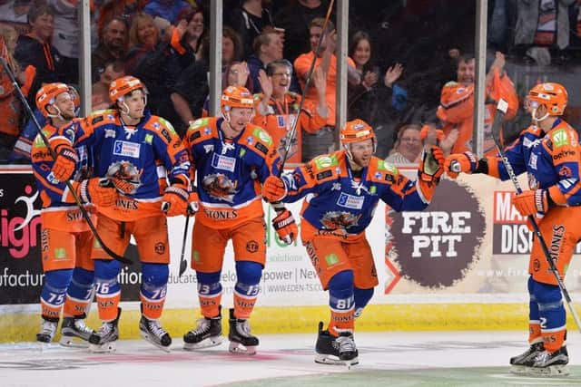 EVERYBODY HAPPY: Sheffield Steelers' players celebrate their late, late winner against Nottingham at Sheffield Arena on Sunday night. Picture: Dean Woolley.