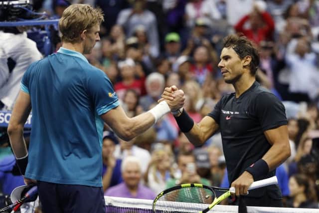 Rafael Nadal shakes hands with Kevin Anderson. Picture: AP/Adam Hunger