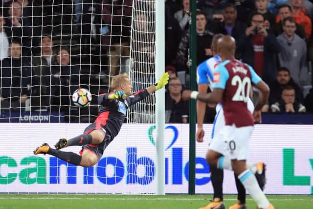 West Ham United's Pedro Obiang (not pictured) beats Huddersfield Town goalkeeper Jonas Lossl to score his side's first goal.