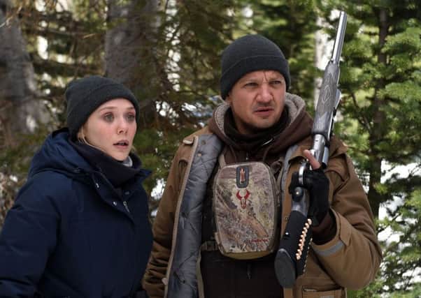PARTNERS: Elizabeth Olsen and Jeremy Renner in Wind River.