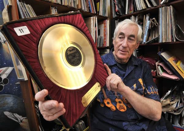 Charles White known as Dr Rock is selling his wonderful collection of vinyl records from his home in Scarborough. Pictured with his rare Bill Hayley gold disc.
Pictures by Richard Ponter.