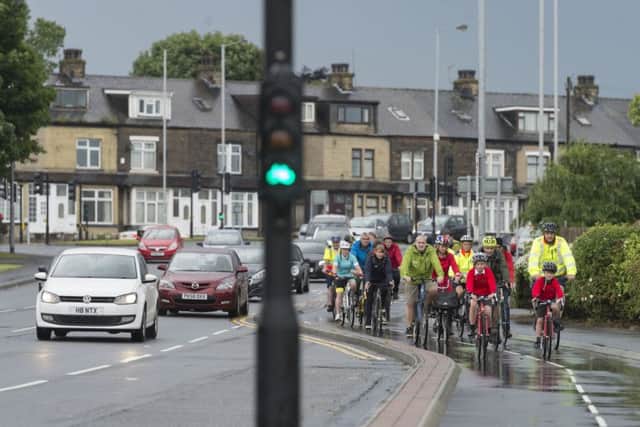 Cyclists using the  cycle route near Thornbury Gyratory, Bradford.