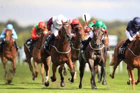 Laurens (centre left) - ridden by P.J. McDonald - wins the William Hill May Hill Stakes at Doncaster. Picture: Mike Egerton/PA