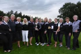 Huddersfield pose with the trophy after their A Team Interclub success at Scarcroft.