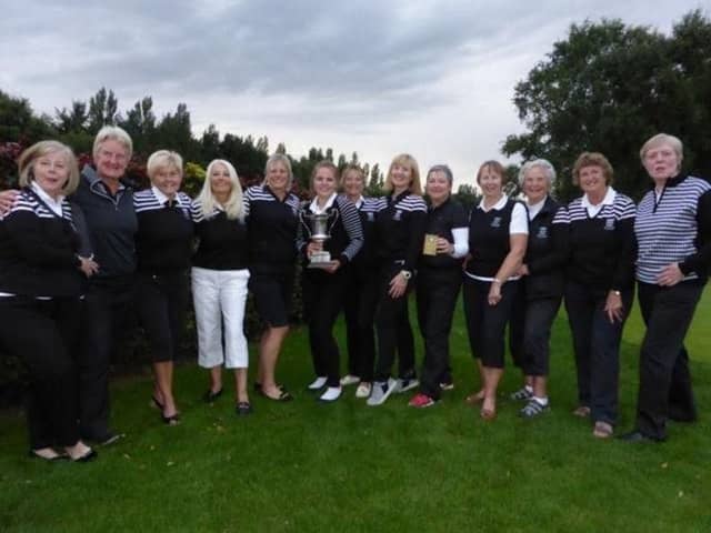 Huddersfield pose with the trophy after their A Team Interclub success at Scarcroft.