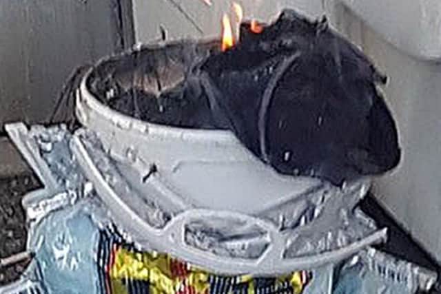 Image issued by Sylvain Pennec of a bucket on fire on a tube train at Parsons Green station in west London. Picture: Sylvain Pennec/PA Wire