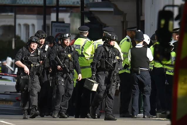 Armed police close to Parsons Green station in west London after the explosion on a packed London Underground train. PA