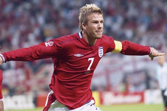 England's soccer team captain David Beckham celebrates after scoring from the penalty spot during their 2002 World Cup, Group F match against Argenina after povercoming his metatarsal injury (AP Photo/Kyodo News)