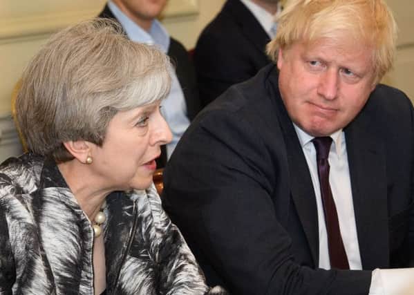 Theresa May and Foreign Secretary Boris Johnson