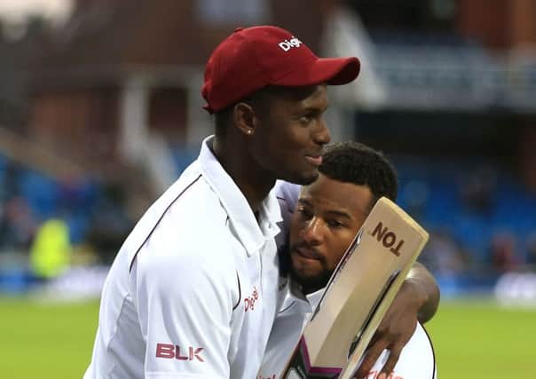 West Indies Shai Hope (facing) is congratulated by Jason Holder after scoring the winning runs during day five of the the second Investec Test match at Headingley, Leeds. (Picture Nigel French/PA Wire)