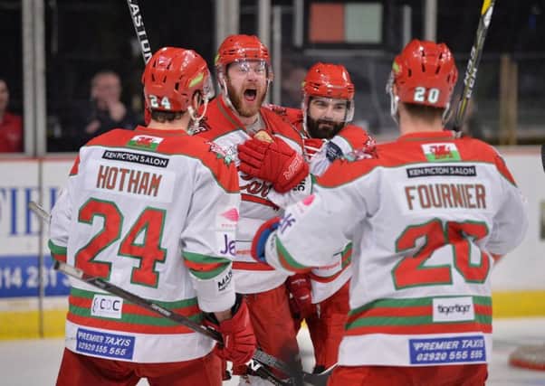 Cardiff Devils' players, including player-coach Andrew Lord, centre, celebrate during a victory in Sheffield last season. Picture: Dean Woolley