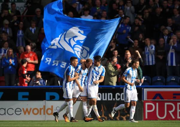 Huddersfield Town's Laurent Depoitre (second left) celebrates.