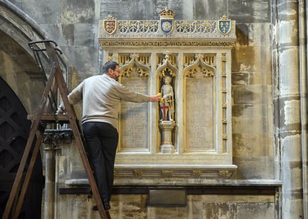 5 Sept 2017...John Adam cleans the newly restored memorial, inside Doncaster Minster, to the men of the Queens Own Yorkshire Dragoons who died during the First World War. Picture Scott Merrylees