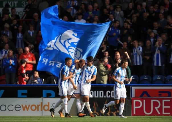 Opener: Huddersfield Town's Laurent Depoitre, second left, celebrates with his team-mates after scoring.