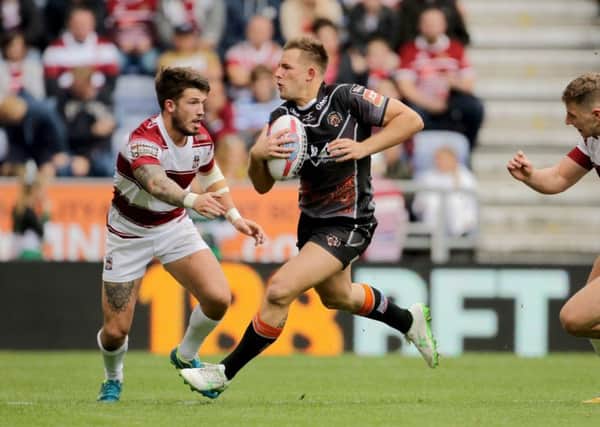 Castleford Tigers' Greg Eden makes a break as Wigan's Oliver Gildart challenges. Picture: Richard Sellers/PA