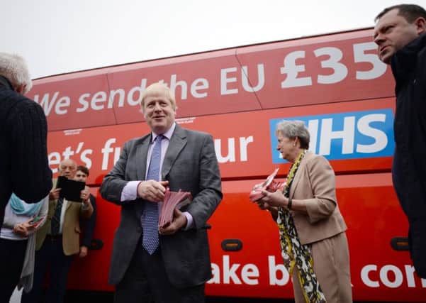 Boris Johnson with the controversial battlebus poster that promised more money for the NHS if Britain voted for Brexit.
