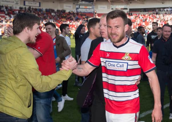 Doncaster Rovers Andy Butler celebrates promotion with the fans after the Sky Bet League Two match at the Keepmoat Stadium, Doncaster, last season. (Picture: PA)