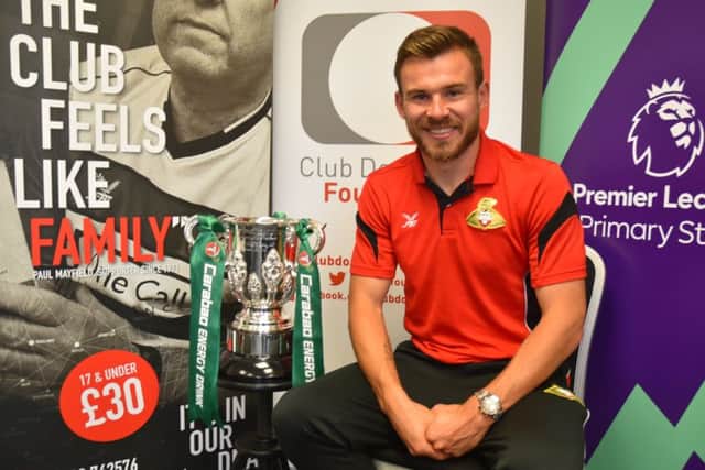 Doncaster's Andy Butler with the Carabao Cup ahead of the club's trip to the Emirates Stadium.