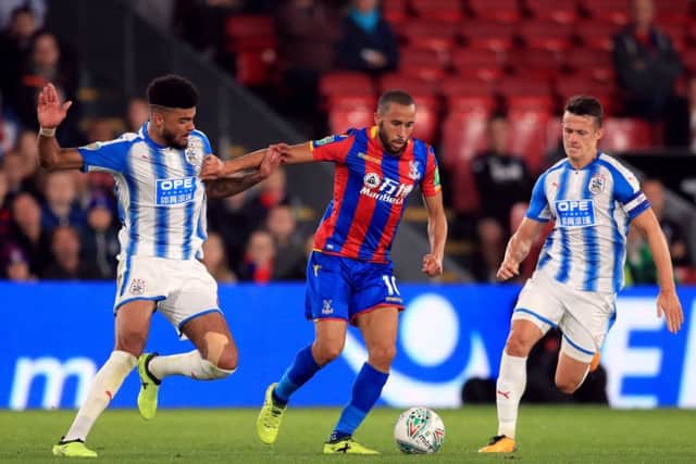 Crystal Palace's Andros Townsend (centre) battles for the ball with Huddersfield Town's Philip Billing (left) and Jonathan Hogg. Picture: Adam Davy/PA