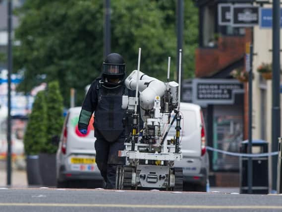 A bomb disposal expert at the scene near Kirkgate Market, Leeds. Picture: James Hardisty.