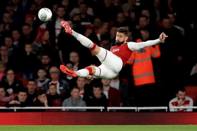 Arsenal's Olivier Giroud in acrobatic action against Doncaster Rovers (Picture: PA)