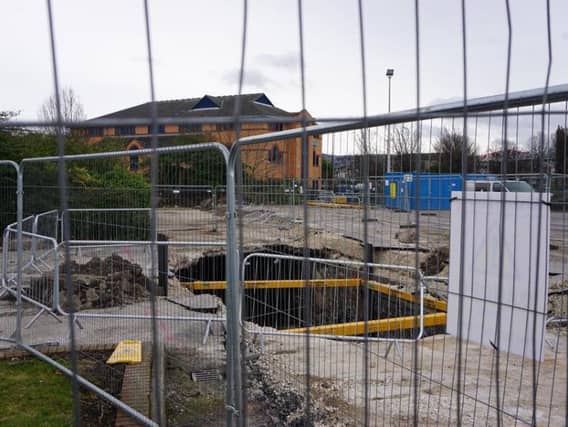 A hole in the Decathlon car park in Sheffield opened up after a culvert over Porter Brook collapsed (Photo: JP)