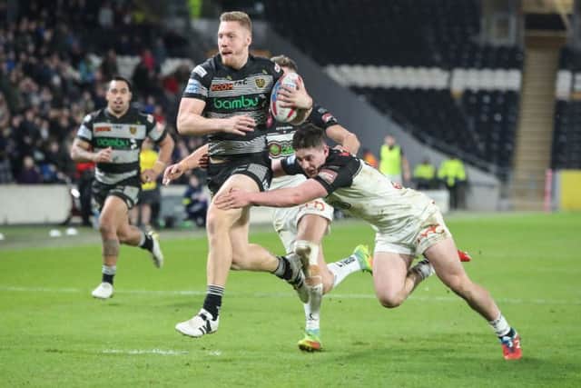 Back with a vengeance: Prop Chris Green, pictured earlier this year breaking through the Widnes defence, is set to bolster Hulls options on his return tonight. (Picture: PA)