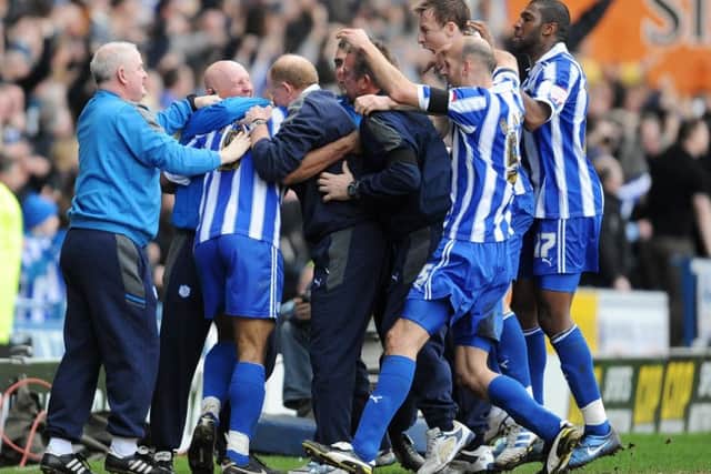 The Sheffield Wednesday players celebrate Chris O'Grady's goal with manager Gary Megson (centre) and the bench during the npower League One match at Hillsbroughon February 26, 2012