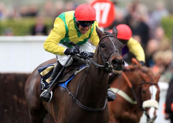 Sizing John ridden by Robbie Power on their way to victory in the Timico Cheltenham Gold Cup.