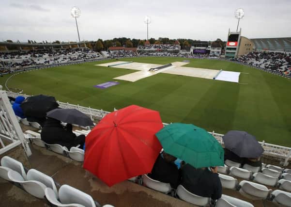 Spectators huddle under their umbrellas at Trent Bridge before  the bad news that England v the West Indies had been abandoned (Picture:  Mike Egerton/PA Wire).