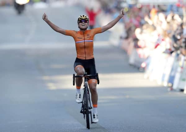 Chantal Blaak of The Netherlands crosses the finish line in first place, during the UCI Cycling Road World Championships World Championships Women Elite Road Race in Bergen, Norway on Saturday. (Cornelius Poppe/NTB Scanpix via AP)