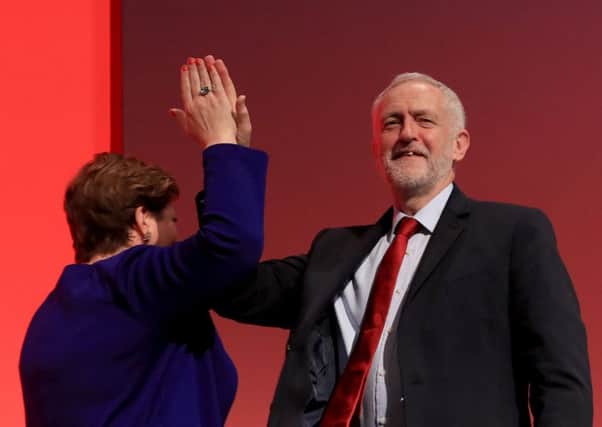 Labour leader Jeremy Corbyn congratulates shadow foreign secretary Emily Thornberry following her speech at the Labour Party conference at the Brighton Centre, Brighton. PA