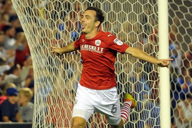 Switched: Josh Scowen celebrates his late winning goal for Barnsley against new club QPR.
Picture: Tony Johnson