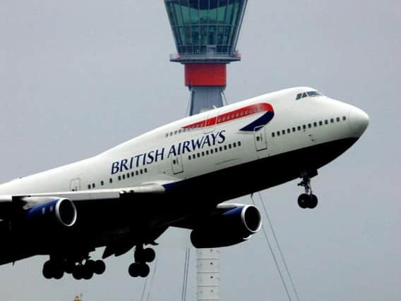 British Airways are investigating after a woman used 'racist' language on a flight to Nigeria.