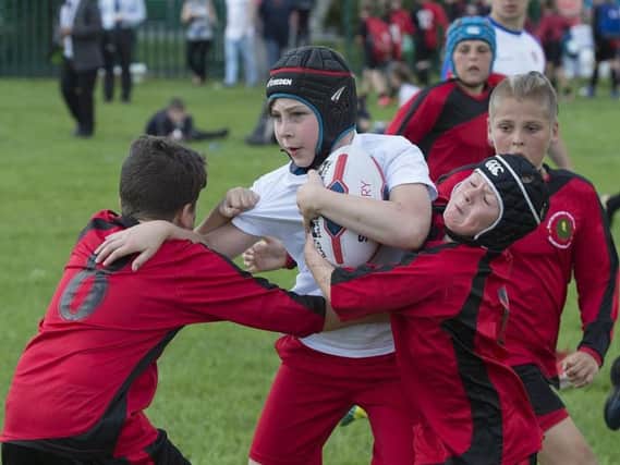 Should tackling be banned in schools rugby?