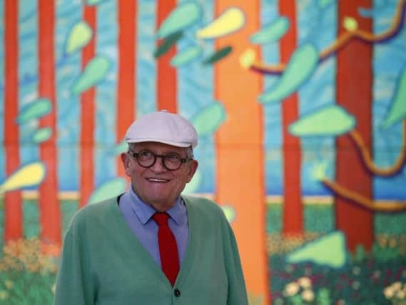 Renowned British painter David Hockney poses during the unveiling of a huge painting he is donating to the Pompidou Center in Paris, "The Arrival of Spring in Woldgate, East Yorkshire.", in Paris, France. Picture: AP photo/Francois Mori.